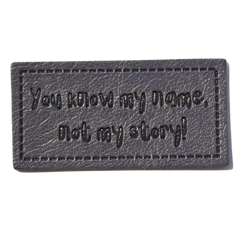 [629 3443 000] "You know my Name, not my story!" Kunstleder Label 4 x 2 cm