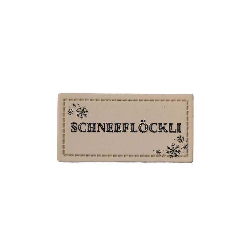 [629 3450 000] "Schneeflöckli" Kunstleder Label 4 x 2 cm